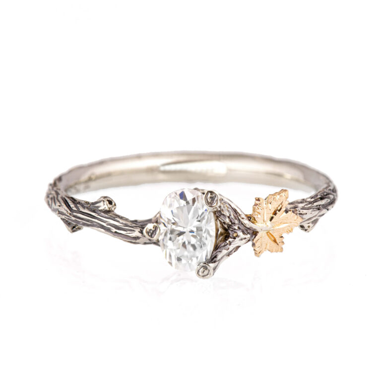 oval diamond twig and maple leaf engagement ring